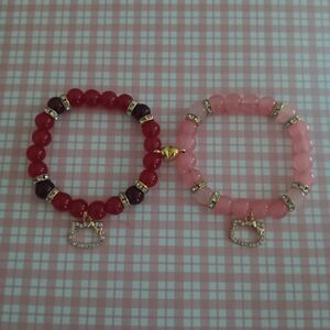 Red hello kitty and pink hello kitty magnetic heart bracelets